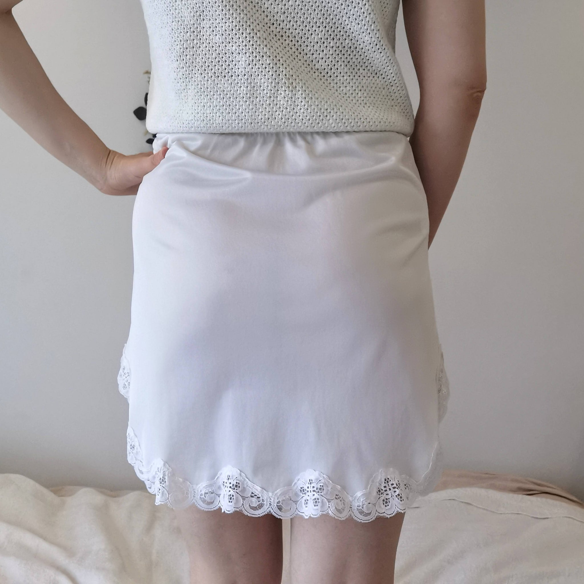 Small vintage white satin and lace slip ...